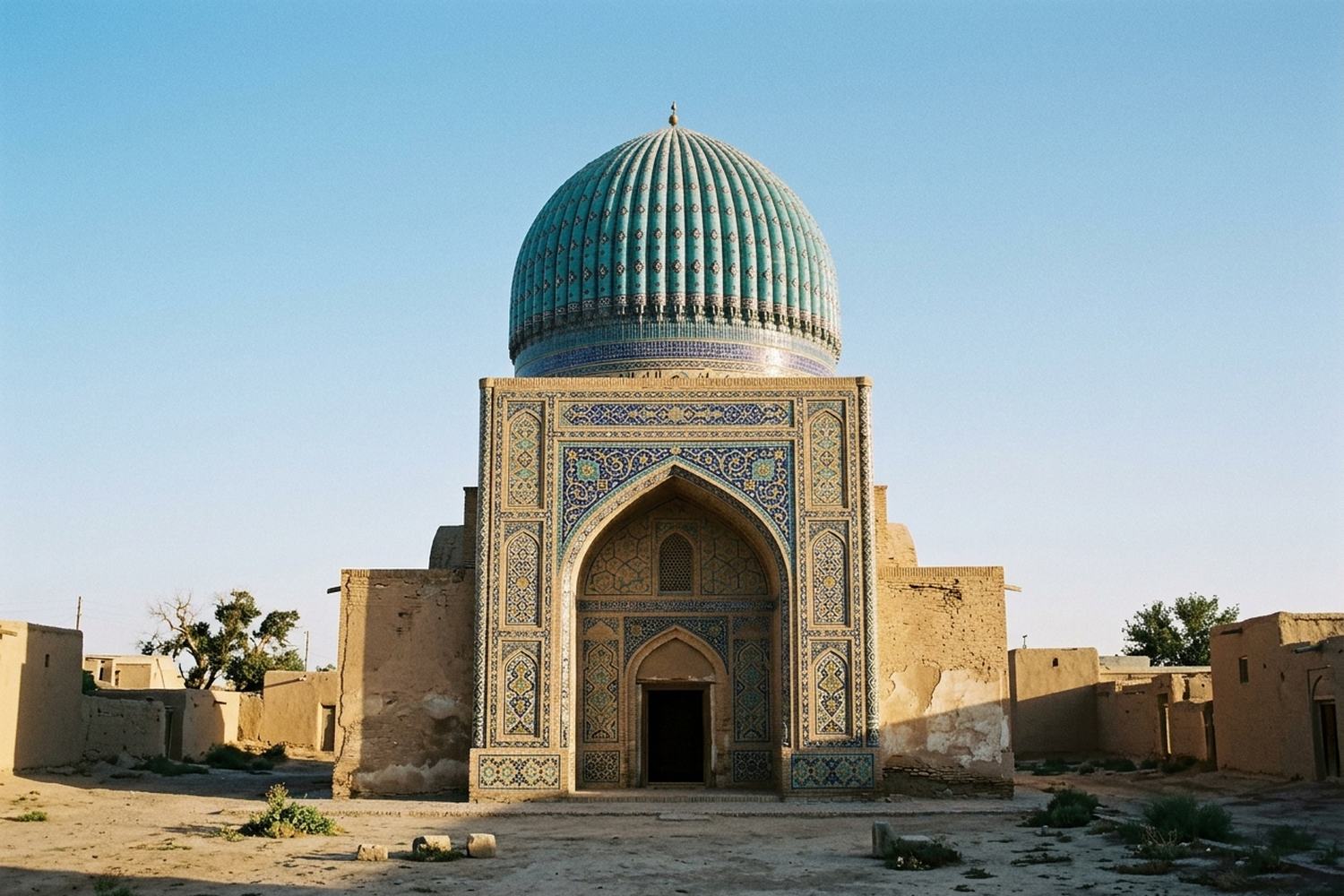 A ribbed dome faced in turquoise and blue geometric tile above a tall portal.